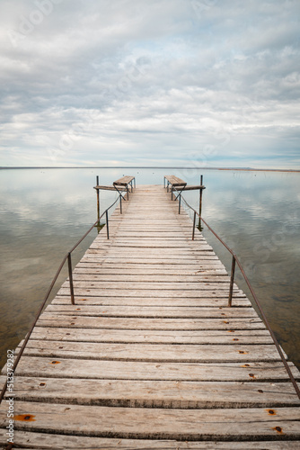 Old wooden dock on lake © Gino Gallucci