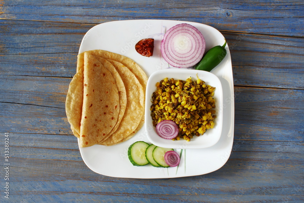 indian gujarati traditional food dish or thali of chapati,roti or