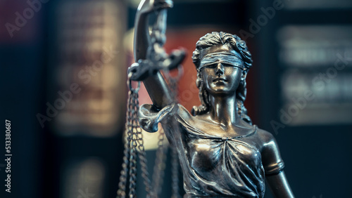 Legal and law concept statue of Lady Justice on books background