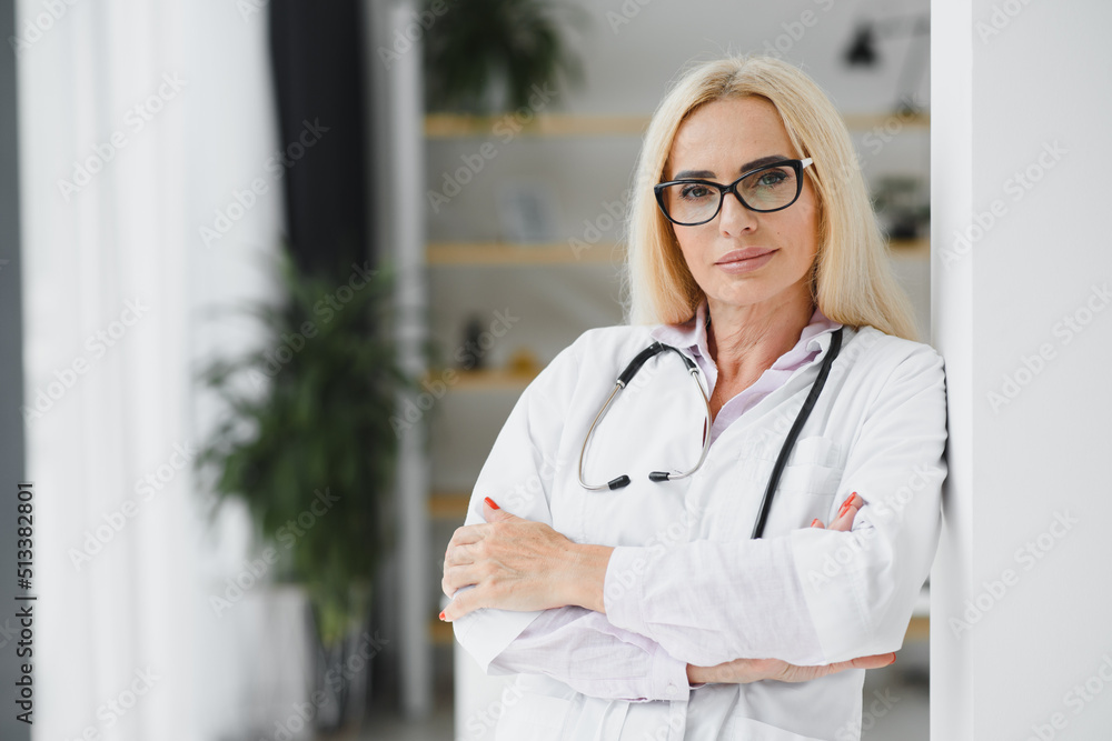 Middle age woman wearing doctor uniform at clinic Middle age woman wearing doctor uniform at clinic