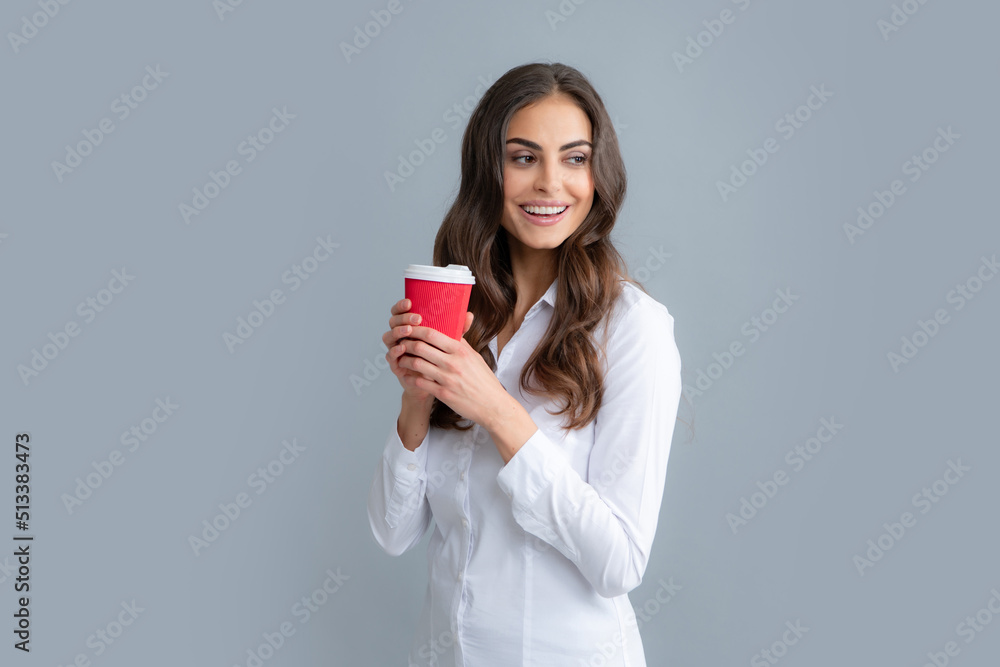 Beautiful young woman enjoying a cup of coffee while relaxing. People, drinks and leisure break, happy young woman with cup of tea or coffee. Beautiful young woman enjoying a cup of coffee while relaxing. People, drinks and leisure break, happy young woman with cup of tea or coffee.