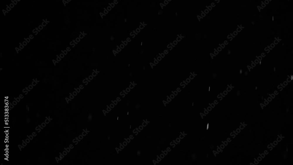 Bokeh of white snow on a black background hd slow motion video. Falling snowflakes on night sky background, isolated for post production and overlay in graphic editor. Bokeh of white snow on a black background hd slow motion video. Falling snowflakes on night sky background, isolated for post production and overlay in graphic editor.