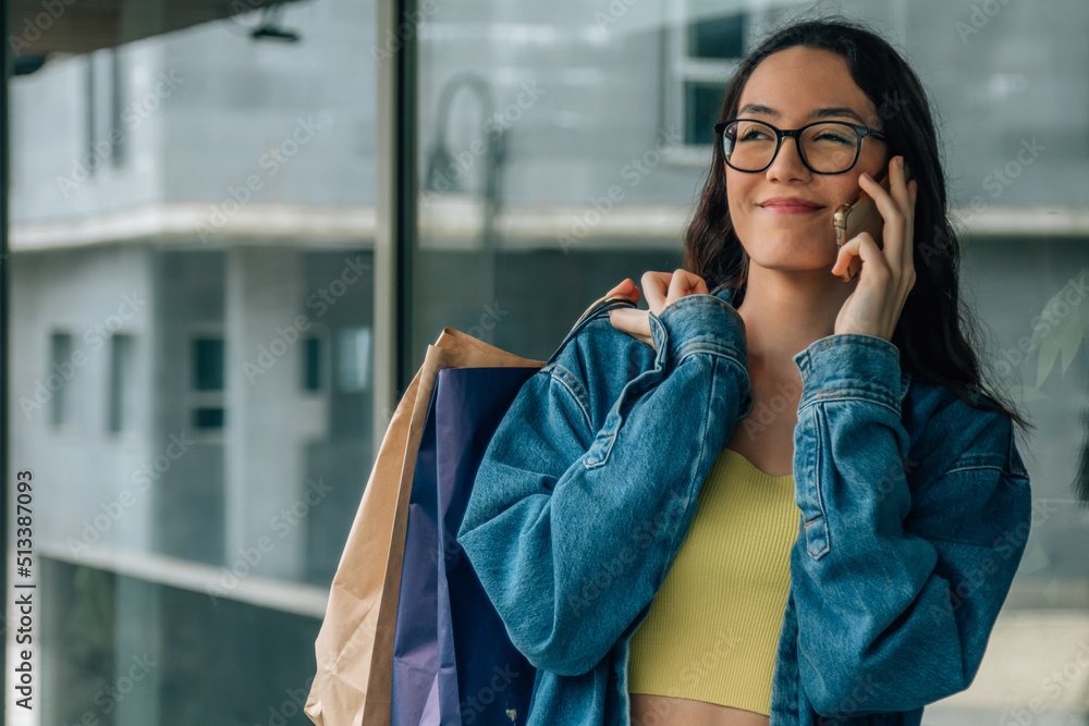 Fototapeta premium young girl with shopping bags