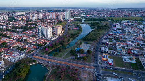 Indaiatuba Ecological Park. Beautiful park in the city center, with lake and beautiful trees and houses. Aerial view © Pedro