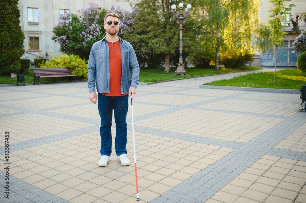 Close-up Of A Blind Man Standing With White Stick On Street