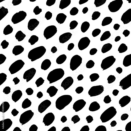 Stylish simple polka dot seamless pattern. Diagonal vector black small brush strokes. Black uneven specks, spots, ink blobs. Dots of different size texture. Abstract monochrome background.