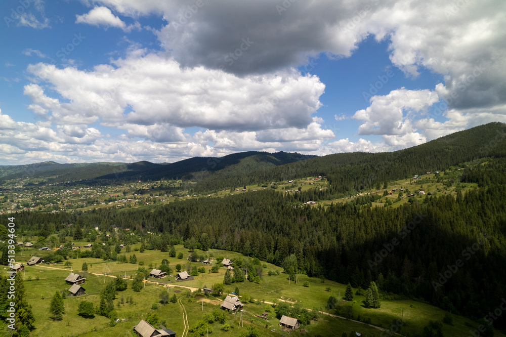 Aerial view of mountains covered with coniferous forests. Aerial View Landscape Mountain. Breathtaking aerial view of the tall mountains covered by the forest. Sunrise