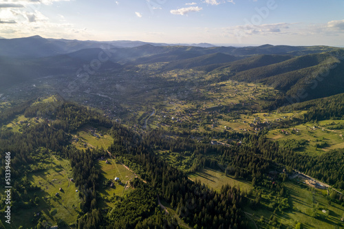 Aerial view of mountains covered with coniferous forests. Aerial View Landscape Mountain. Breathtaking aerial view of the tall mountains covered by the forest. Sunrise