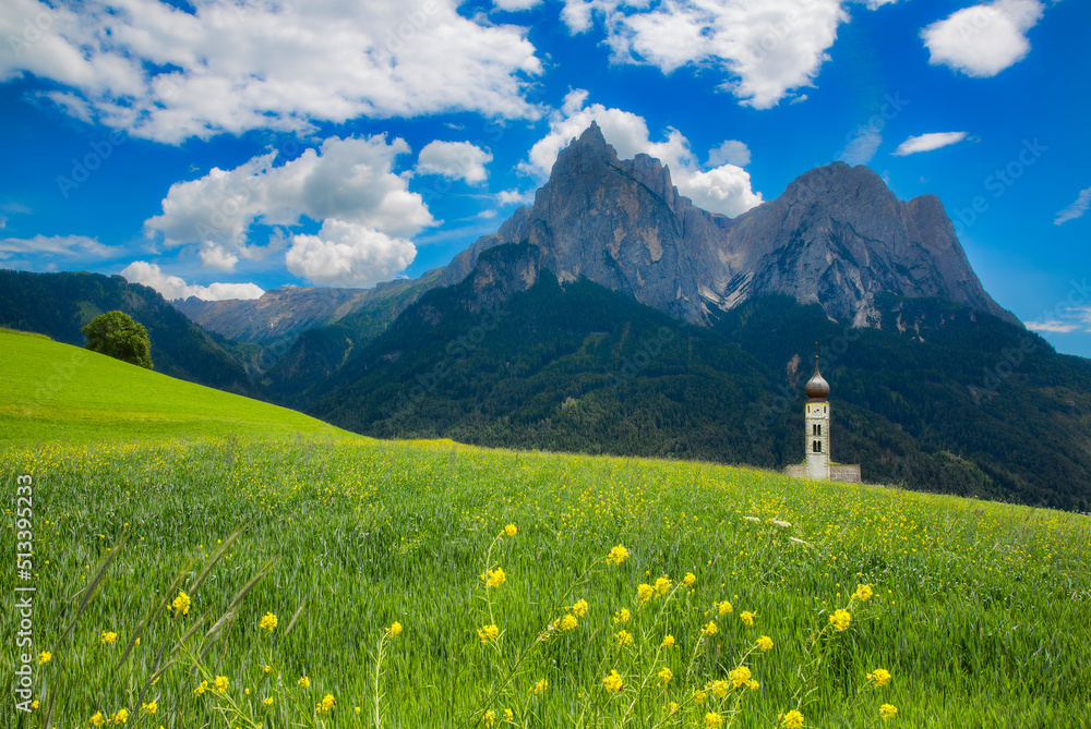 Flower Meadow and St Valentine's Church, Seis am Schlern, Italy, with the Impressive Mountain Schlern in the Background