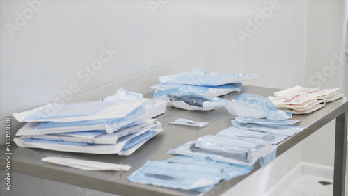 Картината върху платно Medical laboratory details, a set of sterile disposable instruments lying on the table