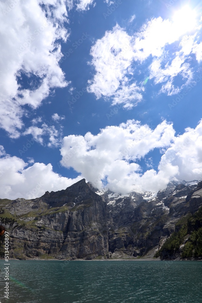 landscape with sky, lake and clouds at the Oeschinensee