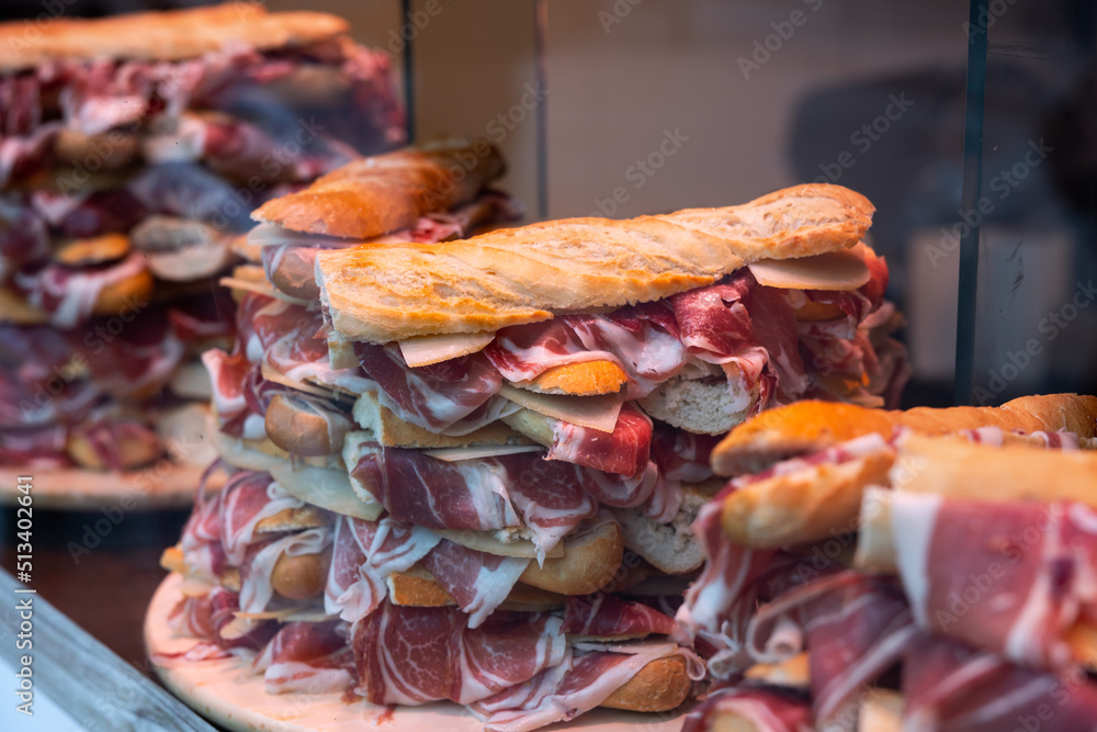 Sandwiches with Spanish ham on bar window in Madrid. Spain