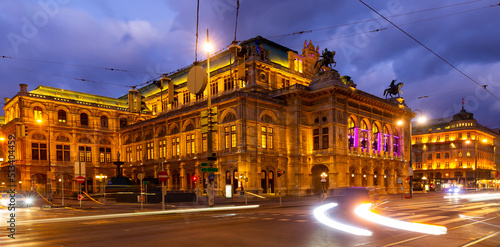 Fototapeta Naklejka Na Ścianę i Meble -  Scenic view of Vienna cityscape overlooking central avenue and neo-Renaissance building of State Opera with evening illumination in winter, Austria.