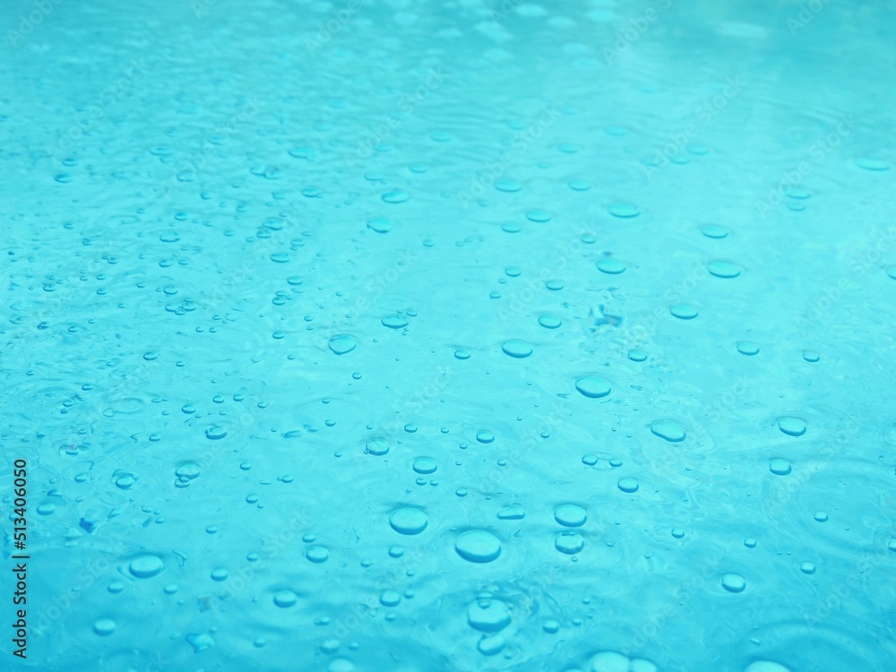 Blue water surface with bubbles texture