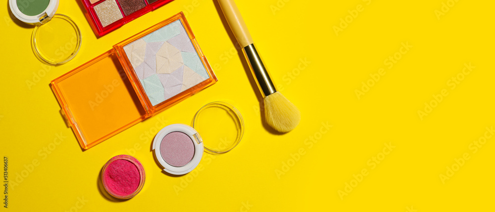 Set of eyeshadows on yellow background with space for text, top view - obrazy, fototapety, plakaty 