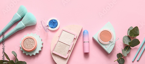 Set of decorative cosmetics and accessories on pink background, top view
