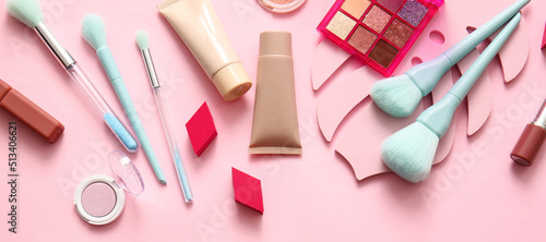Set of decorative cosmetics and accessories on pink background, top view