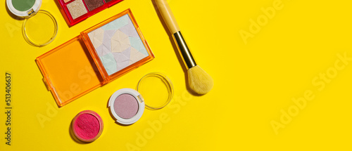 Canvas Print Set of eyeshadows on yellow background with space for text, top view