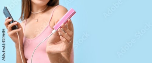 Young woman with phone and ...