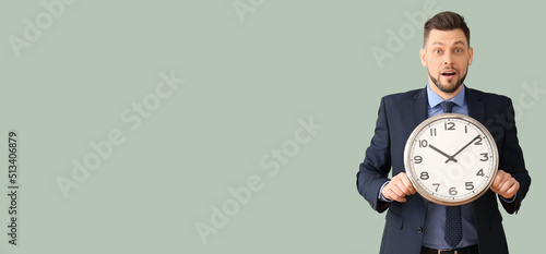 Shocked businessman holding...