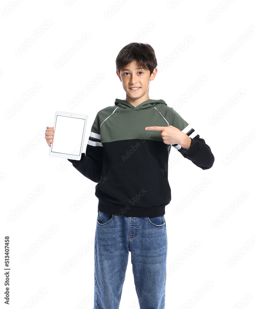 Teenage boy pointing at tablet computer on white background Teenage boy pointing at tablet computer on white background