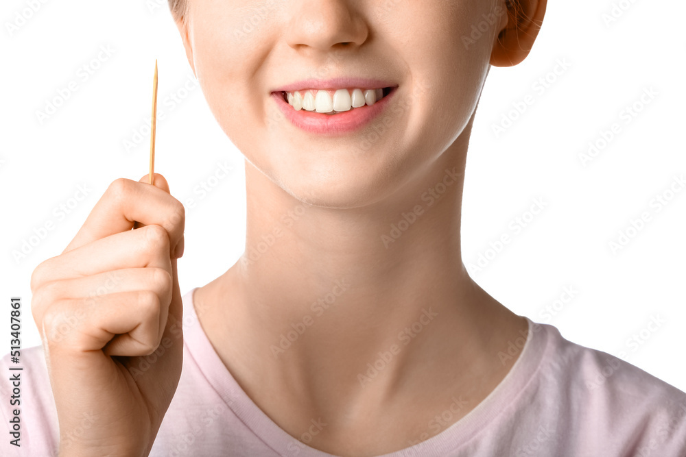 Woman holding bamboo toothpick on white background, closeup Woman holding bamboo toothpick on white background, closeup