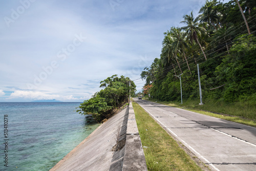 Traveling through a scenic coastal highway bordering the towns of Jagna and Duero in the island of Bohol. photo