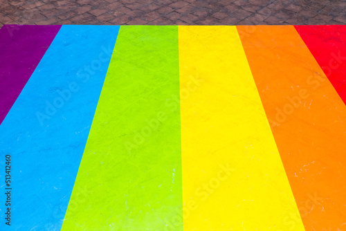 Colorful Rainbow flag on floor.