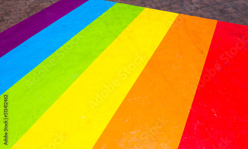 Colorful Rainbow flag on floor. © wanatithan
