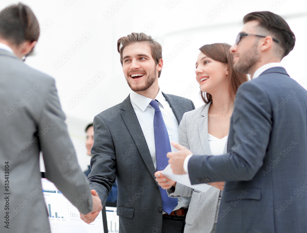 Business people shaking hands, finishing up a meeting Business people shaking hands, finishing up a meeting