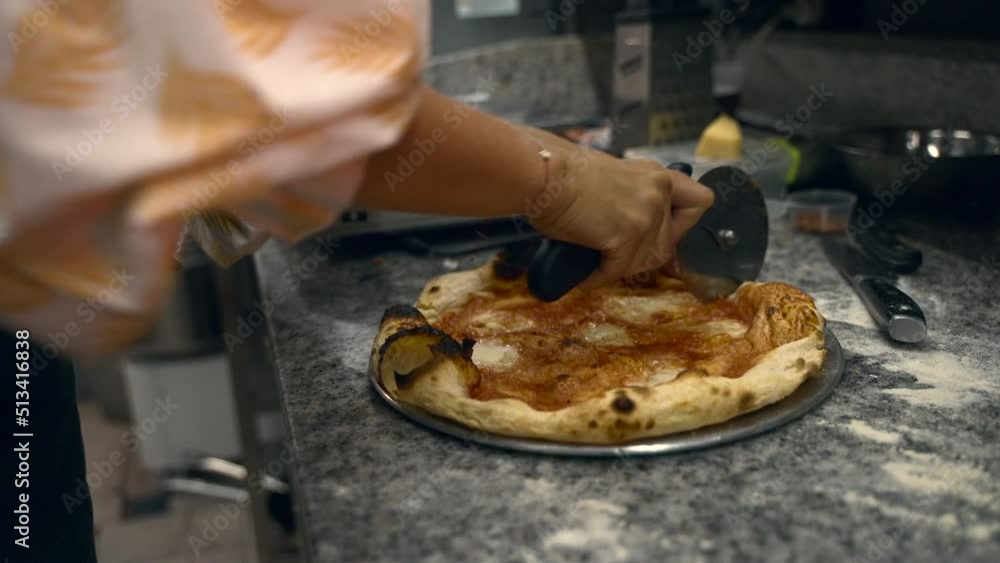 girl prepares pizza in the kitchen at the restaurant. big frame girl prepares pizza in the kitchen at the restaurant. big frame