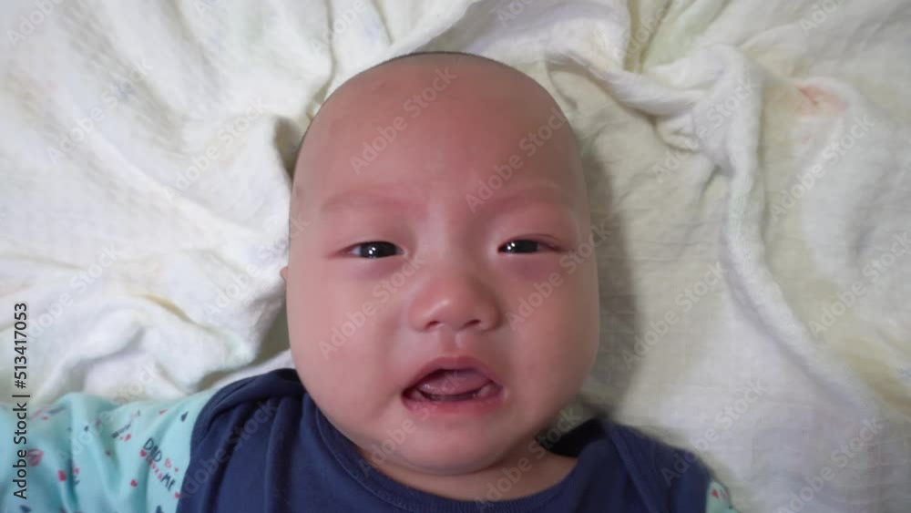 Skinhead baby cry in top down view Skinhead baby cry in top down view