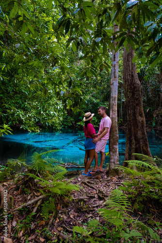 Emerald pool and Blue pool, trees, and mangroves with crystal clear water in Emerald Pool in Krabi Province, Thailand. couple men and woman visit blue pool Krabi photo