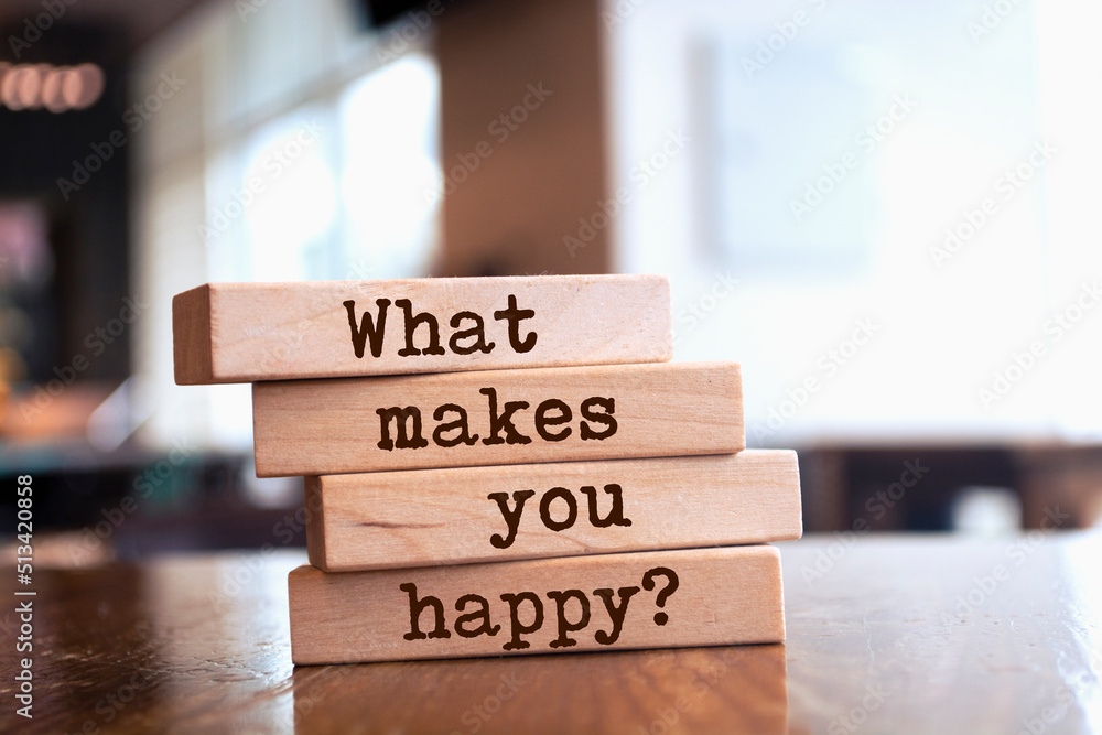 Wooden blocks with words 'What makes you happy?'. Wooden blocks with words 'What makes you happy?'.