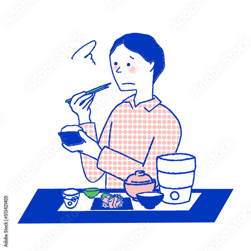 不満そうに食事する男性