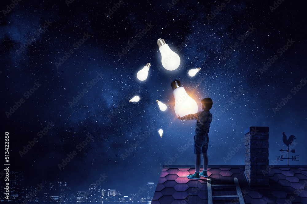 Boy with a glowing light bulb Boy with a glowing light bulb