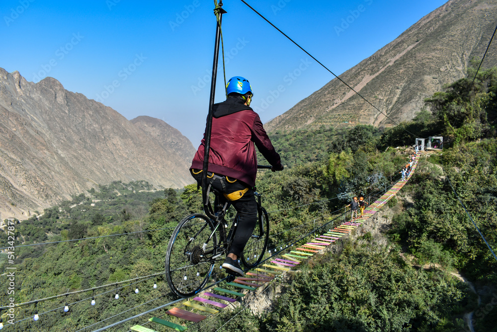 Obraz premium Aerial extreme sport, EXTREME FLYING BIKE, tourist attraction in San Mateo de Otao - Peru.