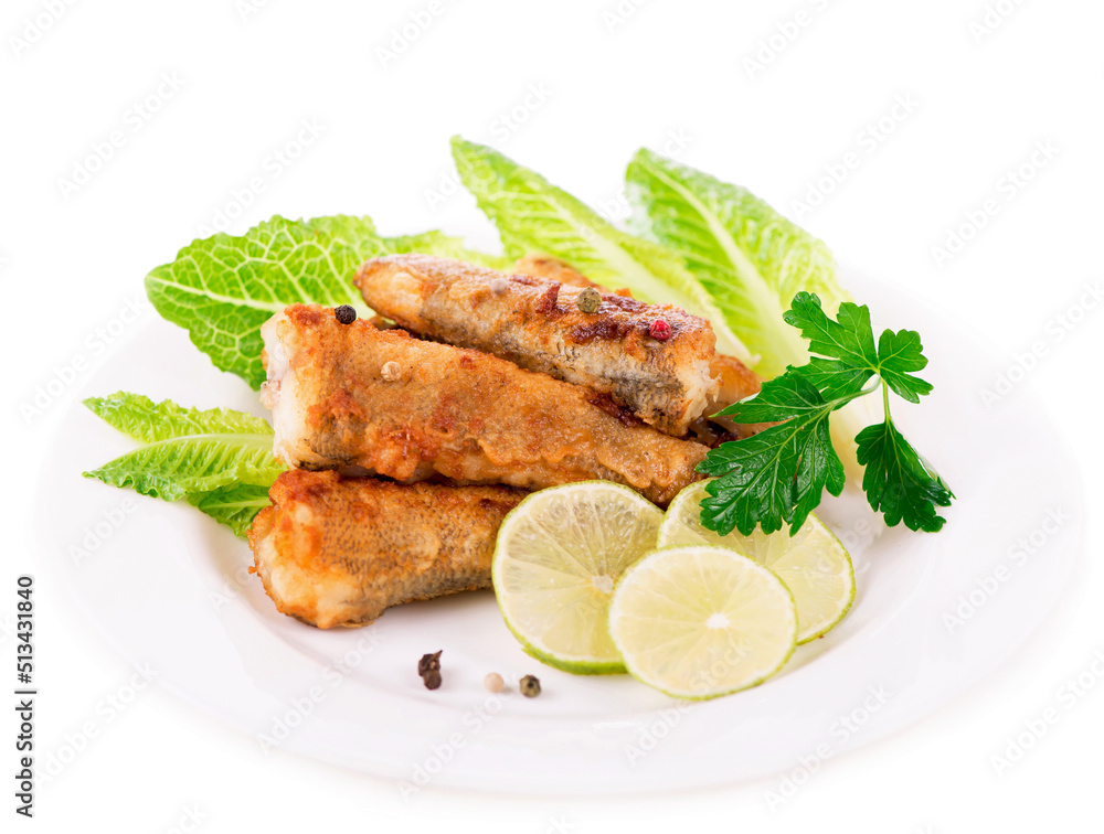 appetizing fish fillet with vegetables and herbs on a white plate