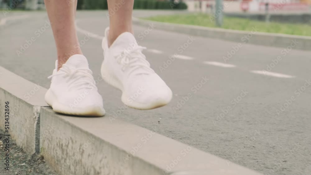 Young attractive woman outdoors by the water. She walks along the curb. Close-up of the legs. Active and healthy lifestyle concept
Young attractive woman outdoors by the water. She walks along the curb. Close-up of the legs. Active and healthy lifestyle concept