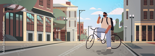 young man with bike using smartphone sportsman riding bicycle workout healthy lifestyle digital addiction concept