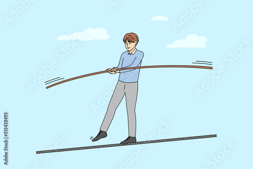 Man walking on thin rope balancing