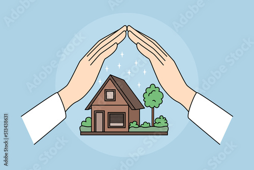 Hands protecting house model