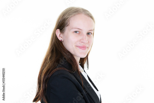 Happy young business blonde woman in suit posing isolated over white wall background