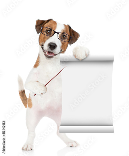 Smart jack russell terrier dog  wearing eyeglasses points on empty list. isolated on white background © Ermolaev Alexandr