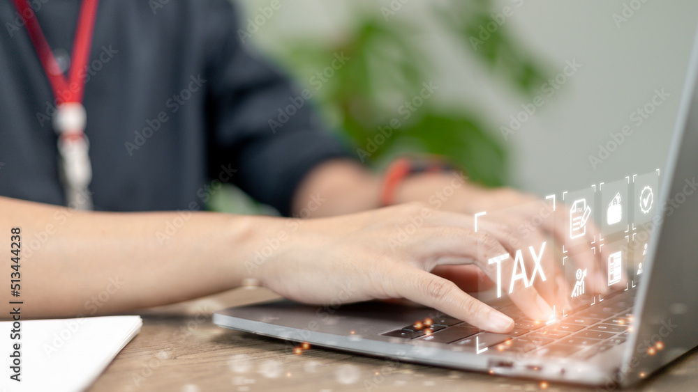 Business use a computer to complete Individual income tax return forms online for tax payment. Government, state taxes. Data analysis, paperwork, financial research, report. Calculation of tax return.