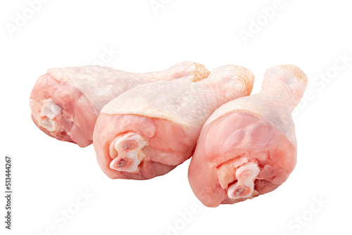 Isolated three fresh raw chicken legs on white background