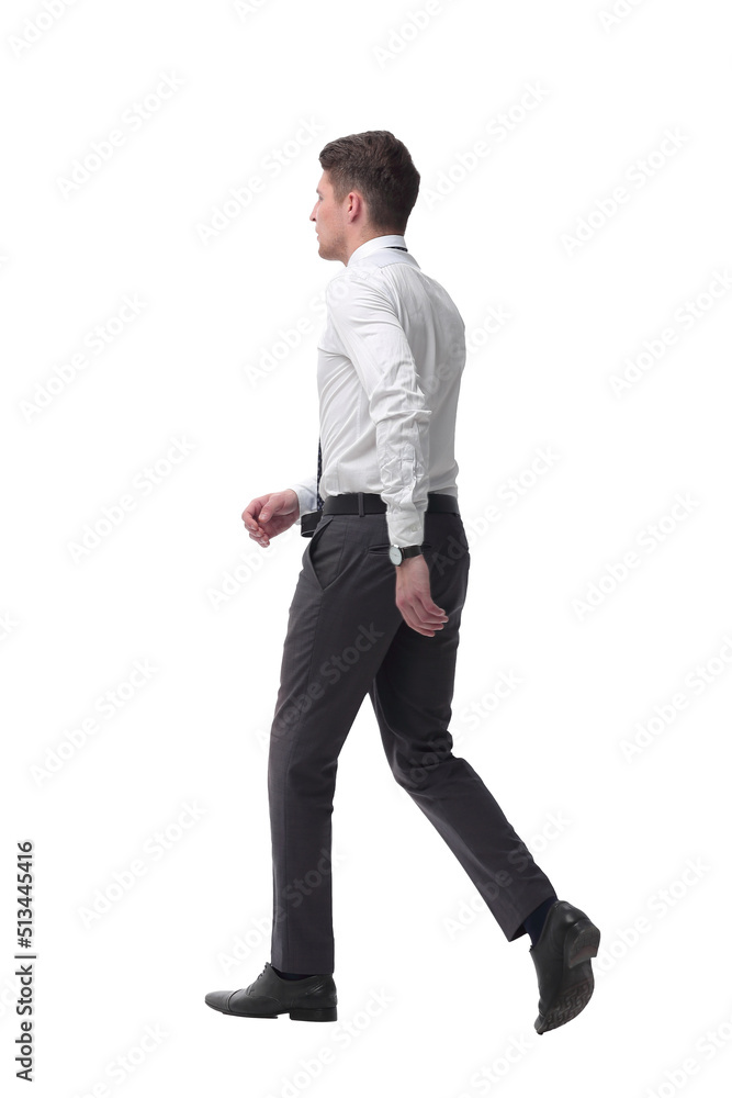 successful young businessman confidently goes forward.isolated on white successful young businessman confidently goes forward.isolated on white