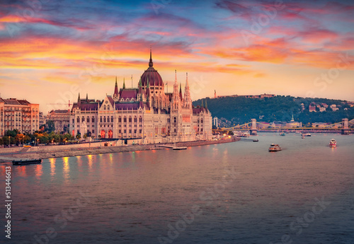 Attractive evening view of Parliament house. Astonishing summer cityscape of Budapest. Amazing sunset in Hungary, Europe. Traveling concept background. © Andrew Mayovskyy