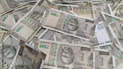 New five hundred rupee india currency bank paper note cash falling over table filled with heap of scattered money. wealth, finance, Loan, savings, success, income, print, printing, rich, tax concept.