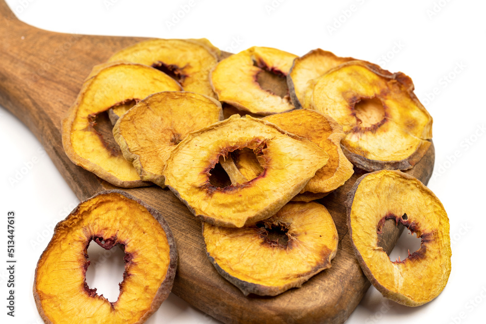 Dried peach slices. Sliced dry peach isolated on white background. Sun-dried fruit. Close up Dried peach slices. Sliced dry peach isolated on white background. Sun-dried fruit. Close up